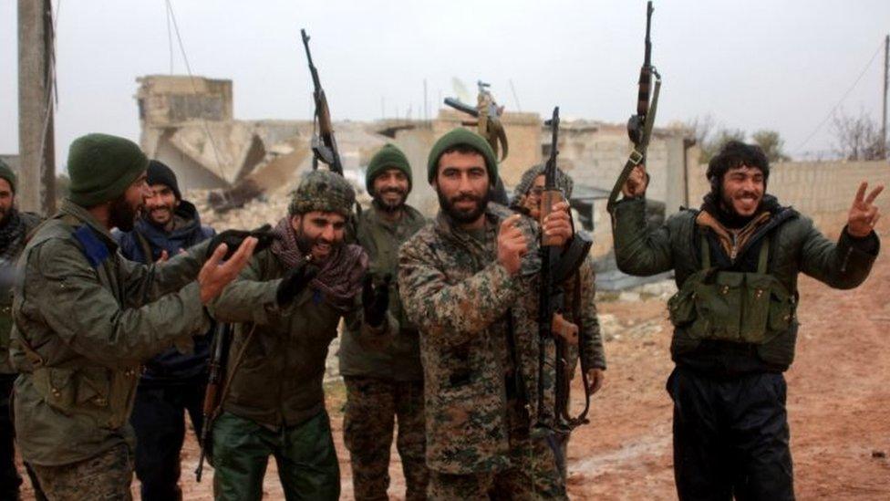 Syrian government soldiers celebrate after taking control of the village of Ratian, north of Aleppo. Photo: 6 February 2016