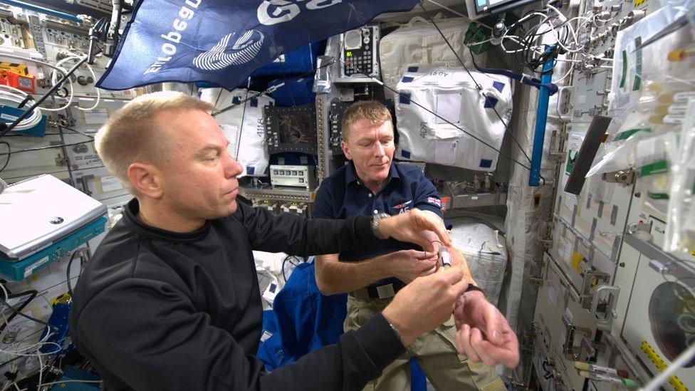 UK astronaut Tim Peake on board the International Space Station - giving blood as part of experiment