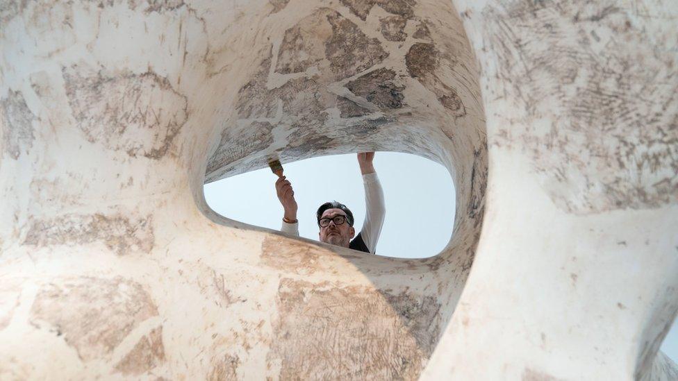 Sculpture conservator James Copper prepares the monumental plaster "Large Spindle Piece" which goes on show for the first time during the new exhibition "Henry Moore: The Sixties" at the Henry Moore Studios and Gardens in Much Hadham, Hertfordshire