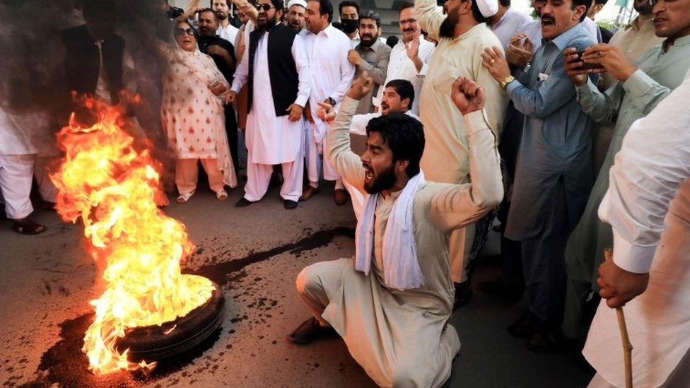 Supporters of the Pakistan Peoples Party protest the arrest of former president Asif Ali Zardari