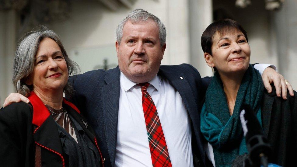 Plaid Cymru Westminster leader Liz Saville Roberts, left, Scottish National Party Westminster leader Ian Blackford, centre, and Green Party MP Caroline Lucas outside the Supreme Court