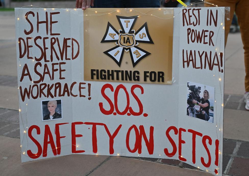 Wynema Chavez Quintana holds a sign calling for better safety on movie sets during a vigil held to honor cinematographer Halyna Hutchins at Albuquerque Civic Plaza on October 23, 2021 in Albuquerque, New Mexico. Hutchins was killed on set while filming the movie "Rust" at Bonanza Creek Ranch near Santa Fe, New Mexico on October 21, 2021