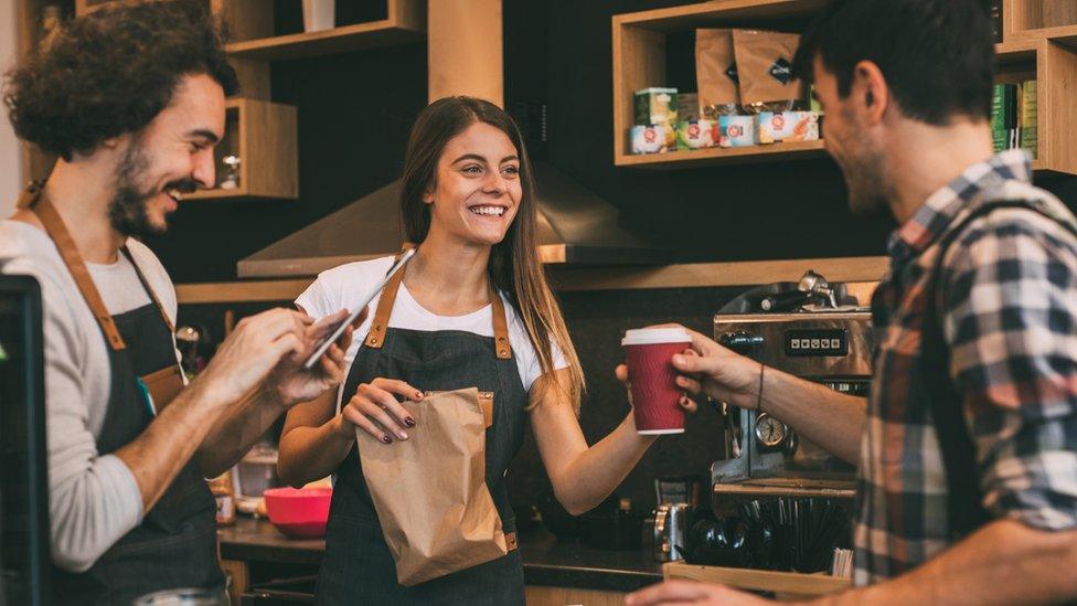 Staff serving coffee