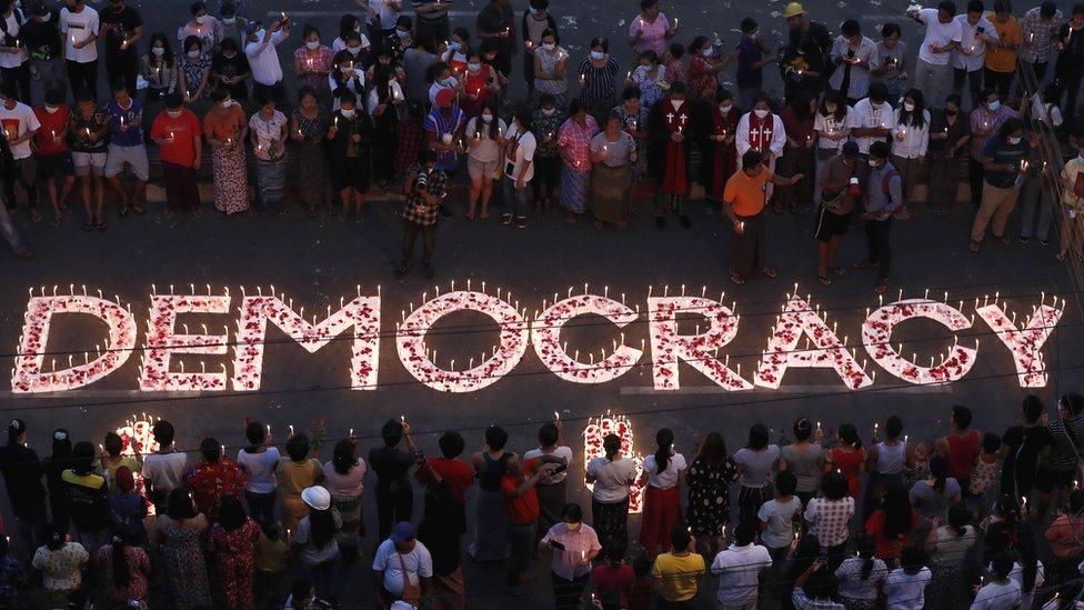 Protesters and residents hold candles and pray during a ceremony to honour protesters who have died during clashes with the military around the country, Yangon, Myanmar, 6 March 2021