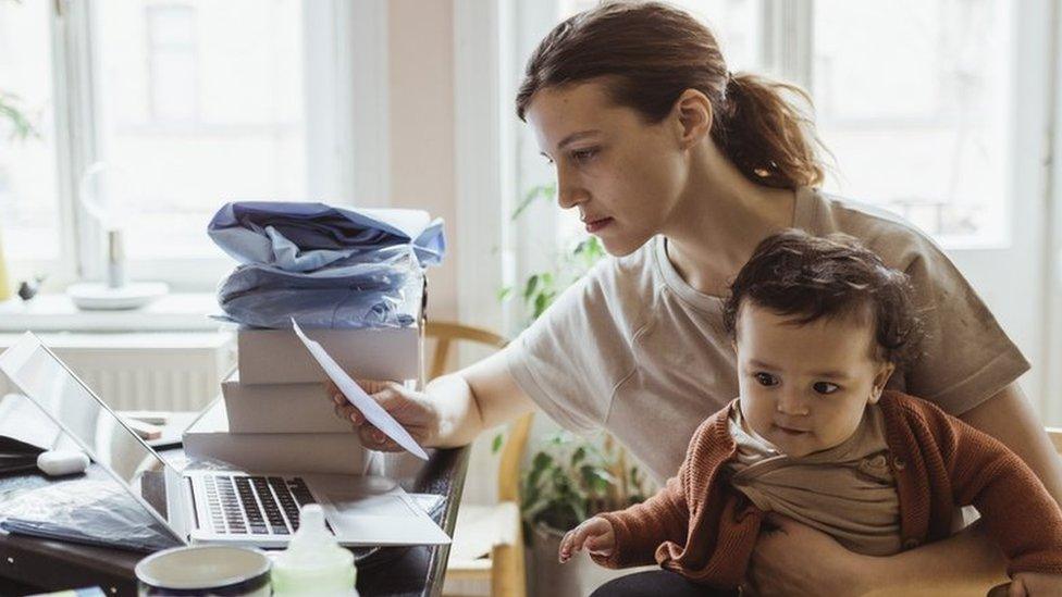 Woman looking a energy bill