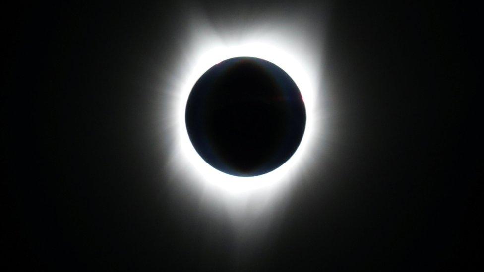 The sun is obscured by the moon during a solar eclipse as seen from an Alaska Airlines commercial jet at 40,000 feet above the Pacific Ocean off the coast of Depoe Bay, Oregon, U.S., August 21, 2017.