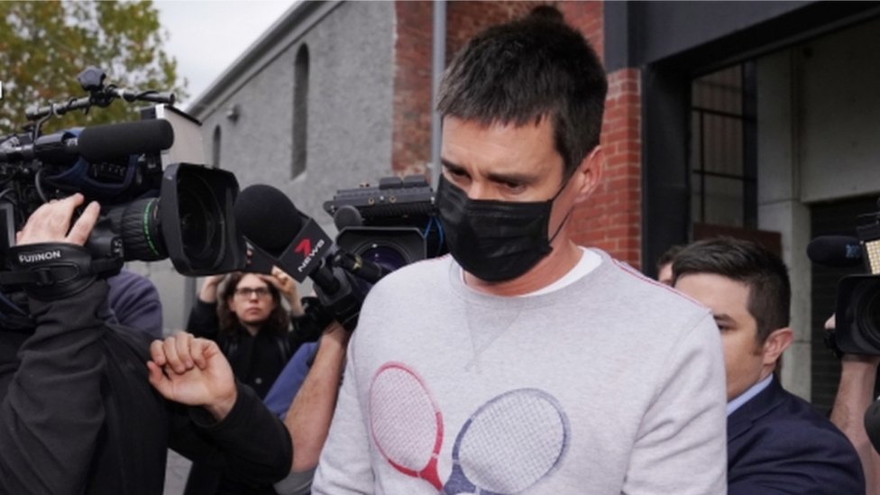 Melbourne man Richard Pusey surrounded by media as he's arrested by police