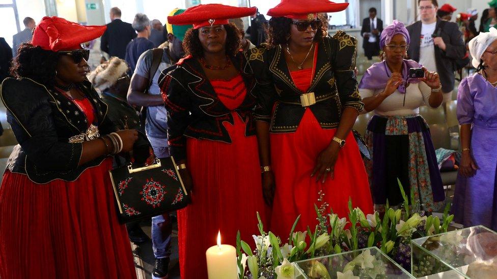 Members of a delegation attend a ceremony in Berlin, Germany, August 29, 2018, to hand back human remains from Germany to Namibia