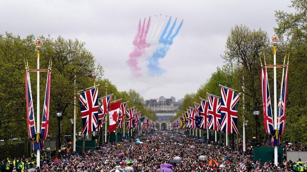 Well-wishers in The Mall in central London to see the flypast by the Red Arrows