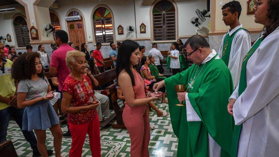 Brazilian Bishop Wilmar Santin (2-R) offers Mass at the Santana Cathedral in Itaituba, Para state, Brazil, in the Amazon rainforest, on September 8, 2019