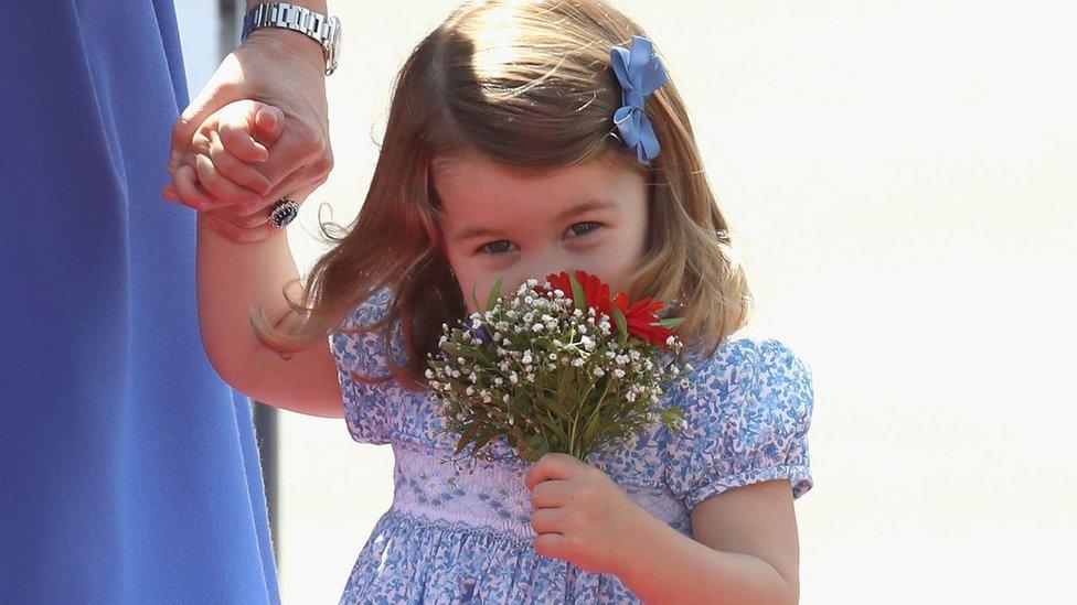 Charlotte arrives at Berlin Tegel Airport holding her mother Kate's hand and a flower