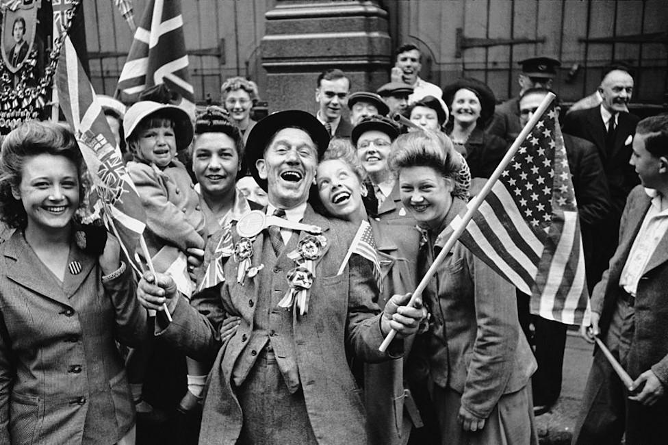 Ecstatic crowds celebrating VE Day in London's Piccadilly, at the end of World War II, 8th May 1945