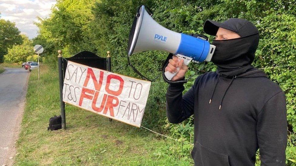 Activist outside T&S Rabbits in East Bridgford