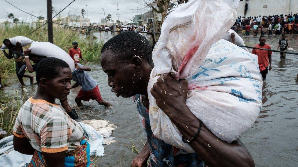 A man in Mozambique carrying rice