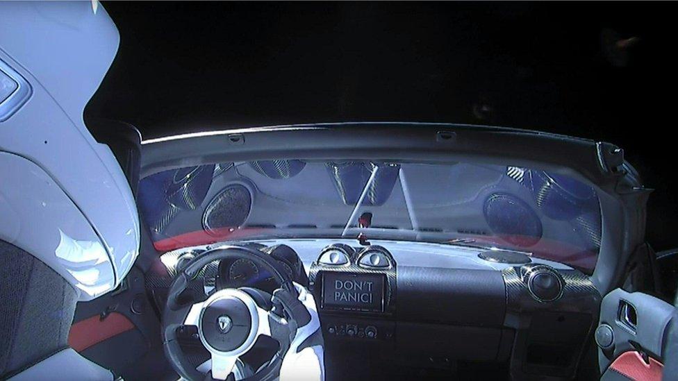 This still image taken from a SpaceX livestream video shows "Starman" sitting in SpaceX CEO Elon Musk"s cherry red Tesla roadster after the Falcon Heavy rocket delivered it into orbit around the Earth.