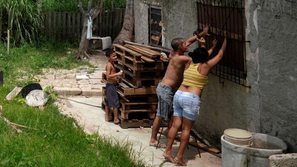A couple preparing for the storm in Guanabo, Cuba