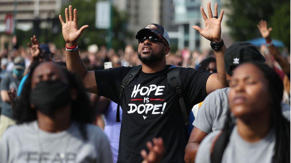 A large group holds a Juneteenth prayer in Atlanta on Friday