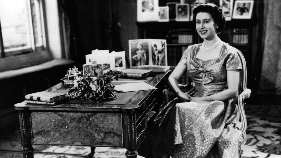 The Queen giving her first TV Christmas message in 1957.