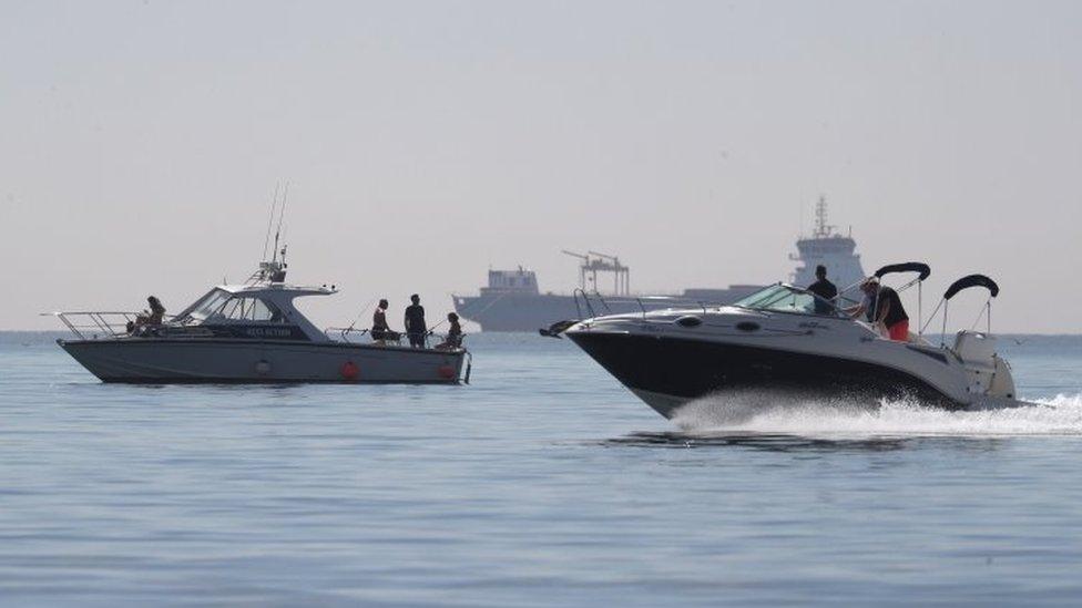 People take to their boats as they enjoy the hot weather on Bournemouth beach in Dorset on 20 May