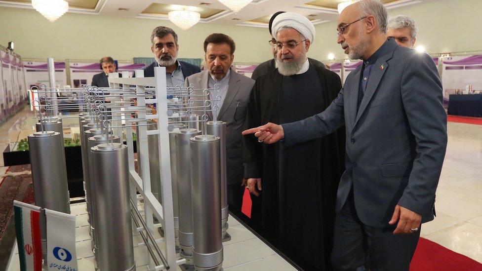 Iranian President Hassan Rouhani is shown nuclear technology by Atomic Energy Organization of Iran chief Ali Akbar Salehi in Tehran on 9 April 2019