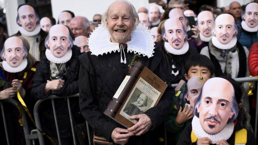 People in Shakespeare masks in Stratford-upon-Avon