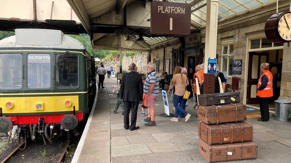 passengers on platform 1 next to the train