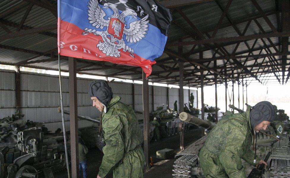 Rebel forces prepare to move their armour away from a frontline position near Mariupol