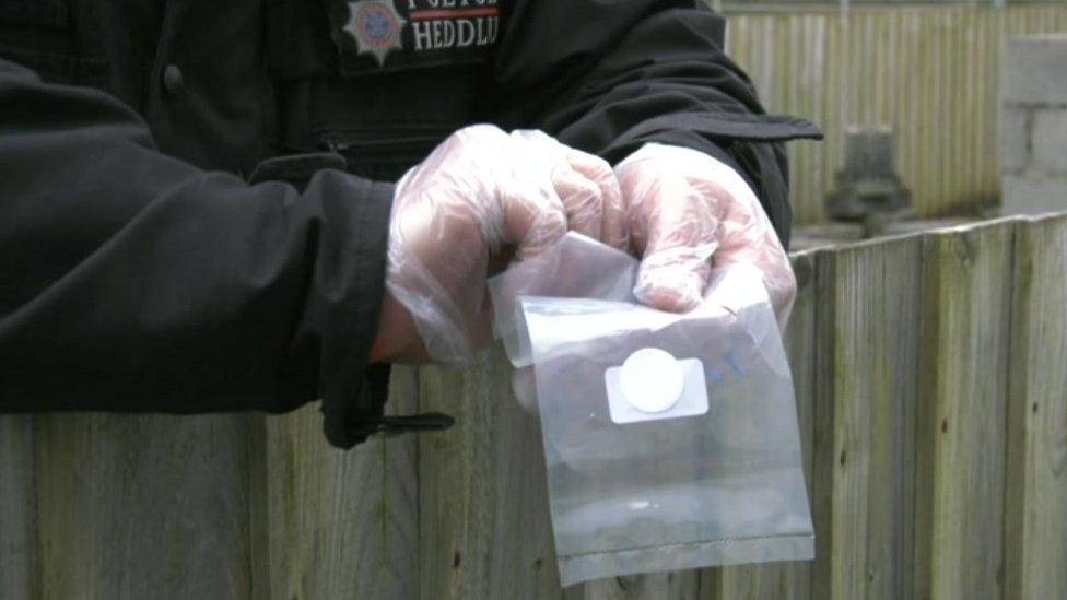 Police officer handling an explosive material