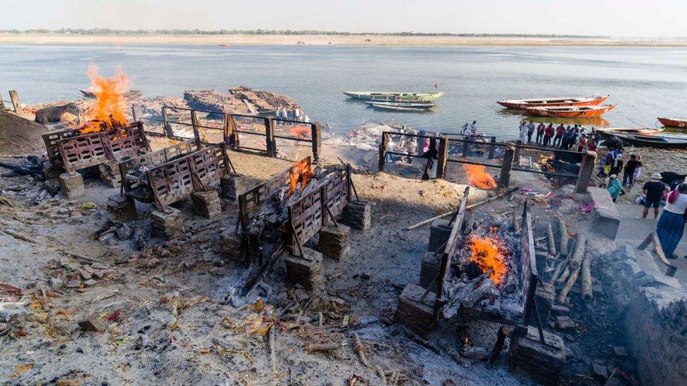 A funeral pyre along the river Ganges in Varanasi