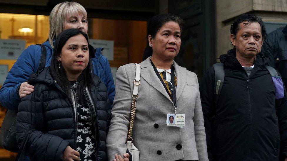 Bennylyn's sister Shela Aquino (left) and father Benedicto Aquino (right) outside the court