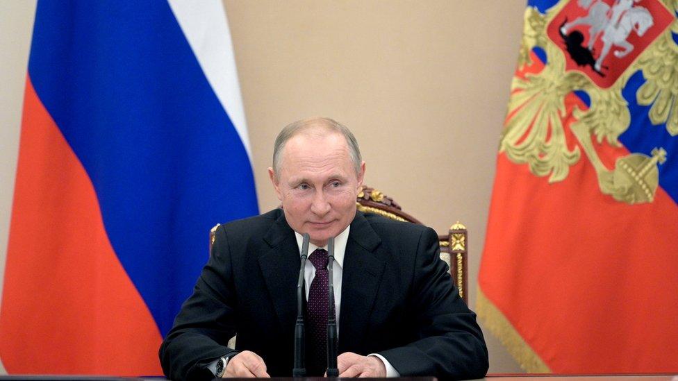 Russian President Vladimir Putin chairs a Security Council meeting in Moscow on February 28