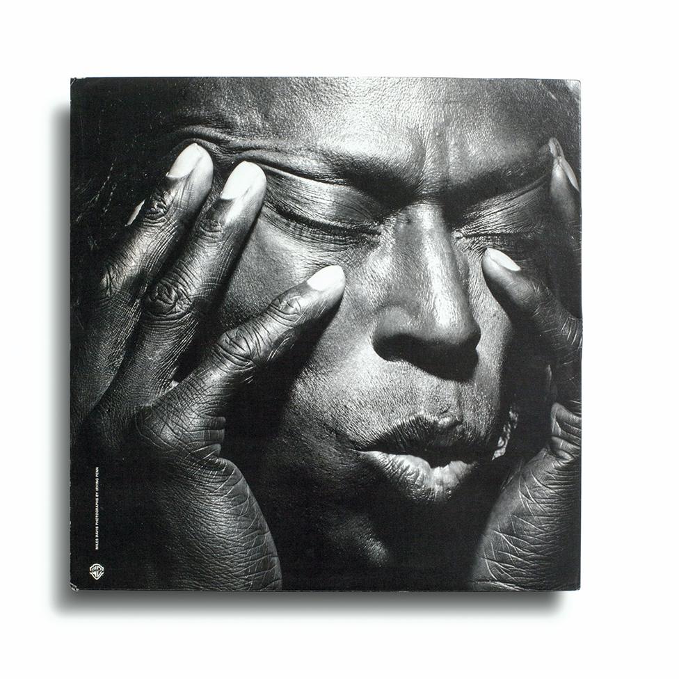 Miles Davis's album cover shows him with his eyes closed, mouth slightly open and fingers pressed against his temples