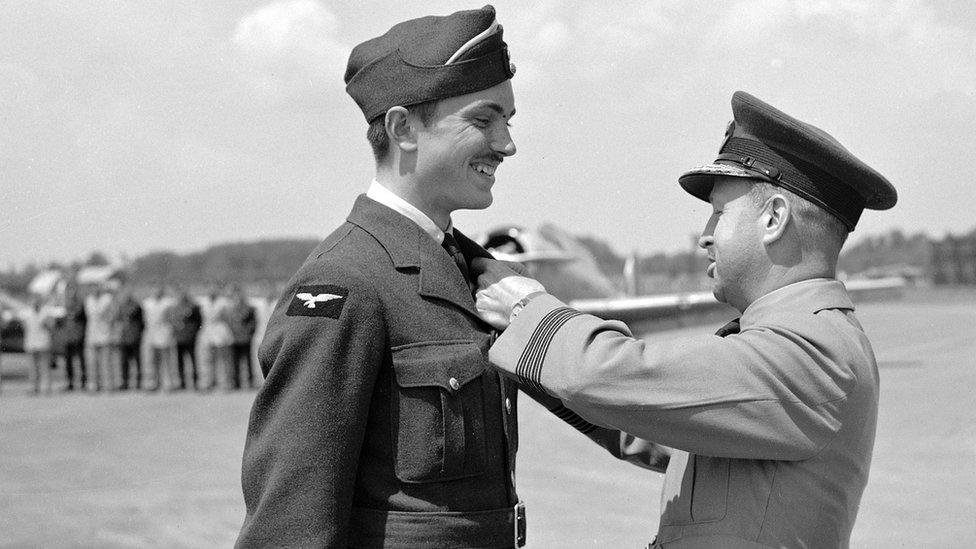 John Gillespie Magee Jr receiving a medal