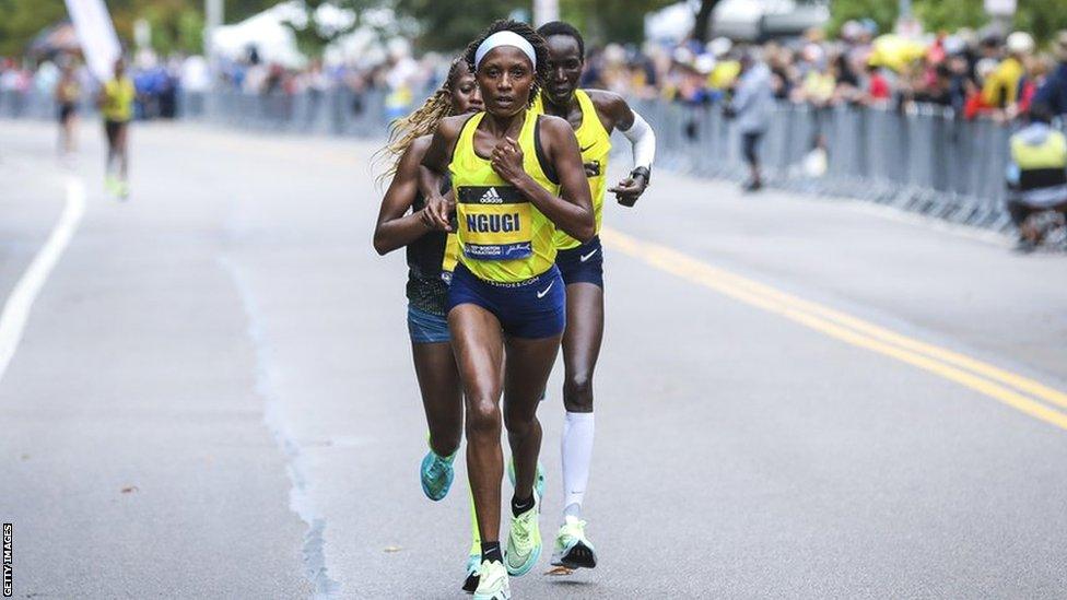 Kenyan runner, Mary Ngugi runs up Heartbreak Hill during the the last stretch of the Boston Marathon in 2021.