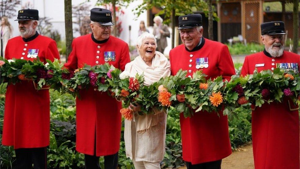 Dame Judi Dench with Chelsea Pensioners during the RHS Chelsea Flower Show