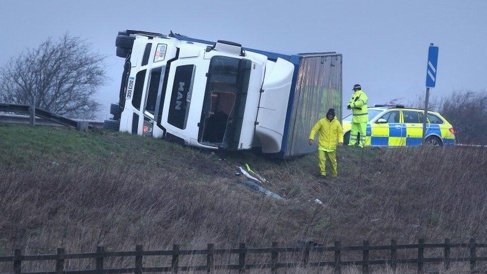 Overturned lorry on the M9