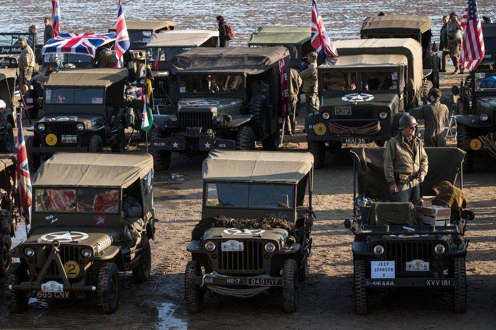 Period vehicles on the beach of Arromanches