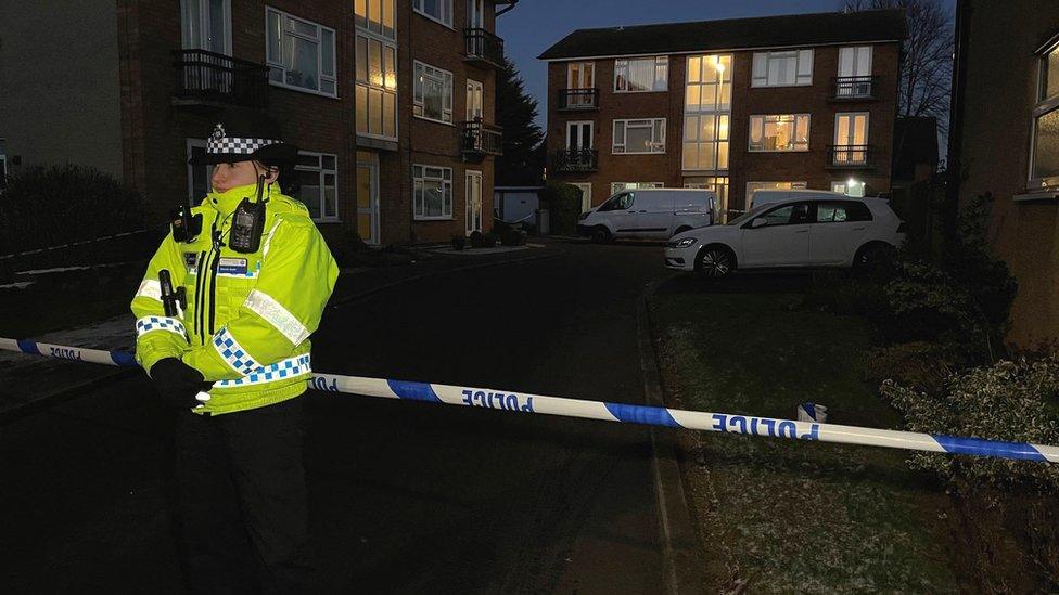 Police officer outside Petherton Court, Kettering