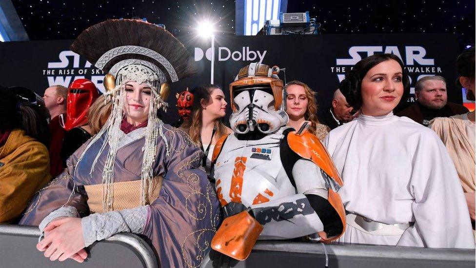 star-wars-premiere-fans-dressing-up-as-queen-amidala-an-orange-clone-trooper-and-princess-leia.