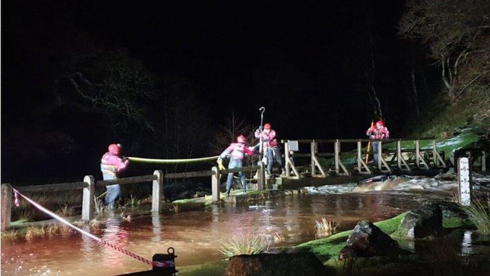 Vehicle in swollen flood waters