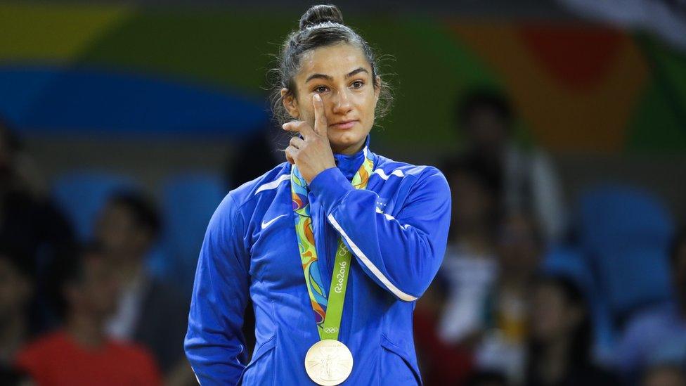 Gold medallist Majlinda Kelmendi of Kosovo waves to the crowd in Rio