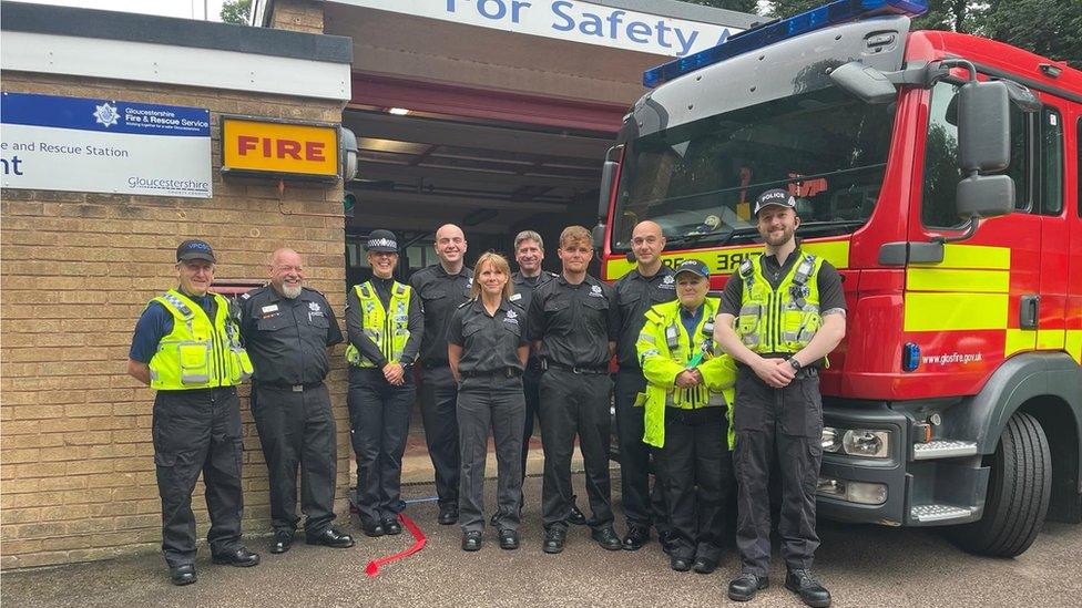 Police officers and fire fighters outside council building