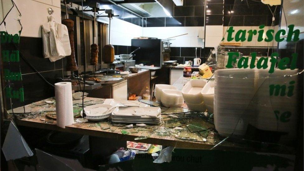 A window of a Turkish kebab restaurant is broken after a demonstration of by Legida in Leipzig, 11 January 2016