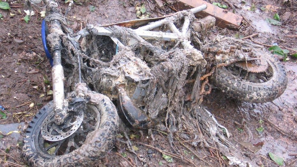 Bike covered in sewerage