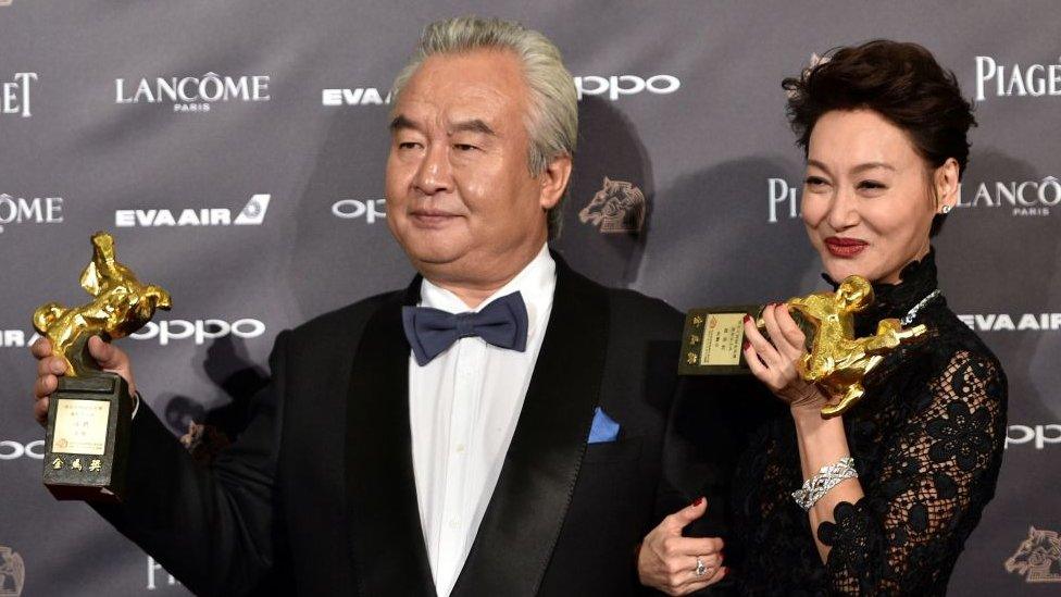 Hong Kong actress Kara Hui Ying-hung (R) poses with Chinese actor Tu Men (L) at the Golden Horse Awards