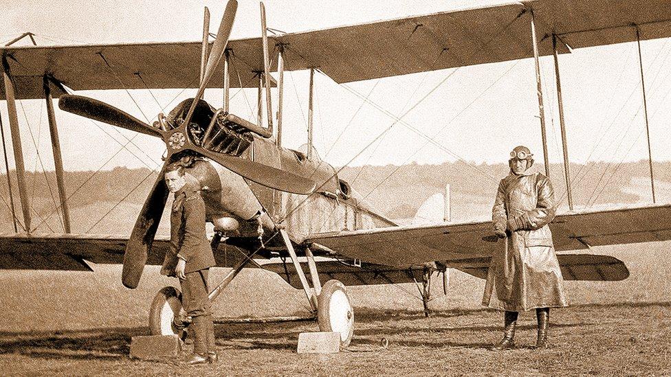 Two men around a plane