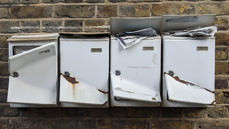 Overflowing mail boxes