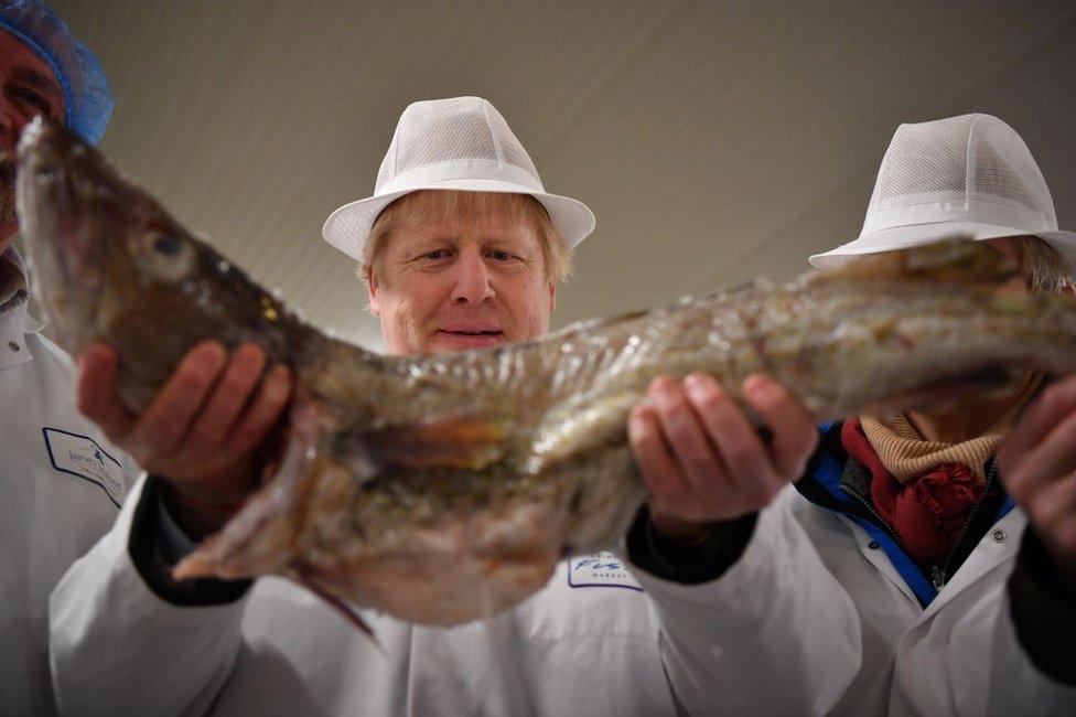 Boris Johnson with a fish