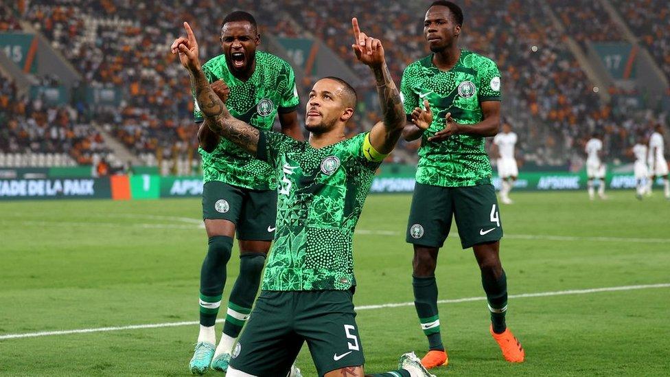 William Troost-Ekong (centre) celebrates scoring a penalty for Nigeria against South Africa at the 2023 Africa Cup of Nations