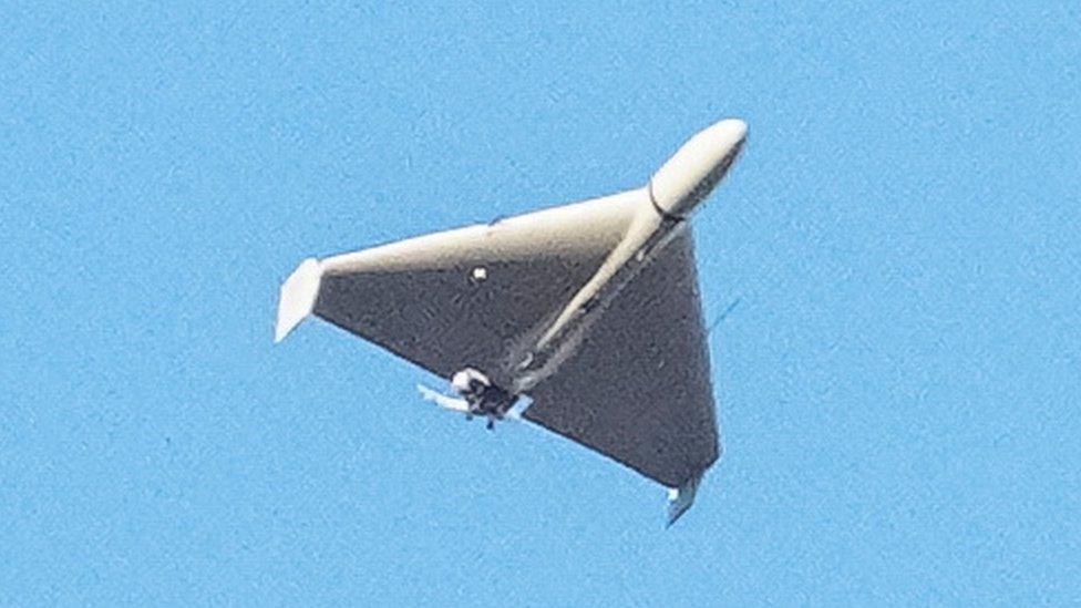 Russian explosive drone - believed by Ukrainian authorities to be an Iranian-made Shahed-136 - is seen flying over Kyiv, Ukraine, on 17 October 2022